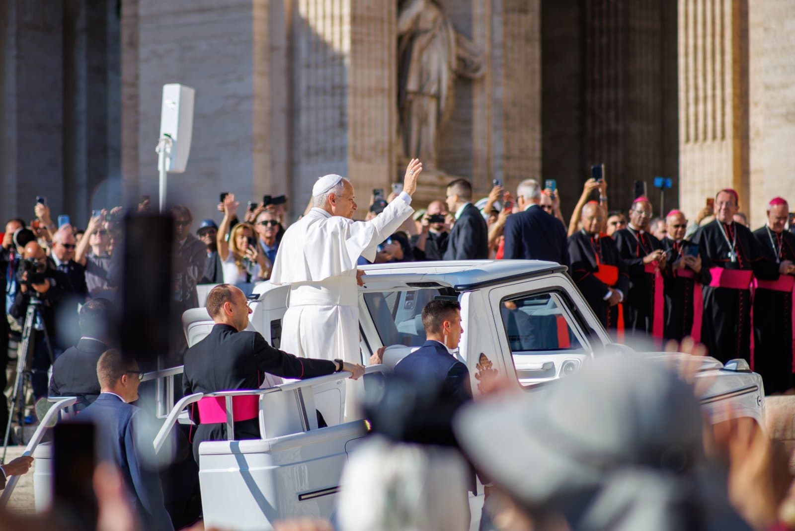 Pope Leo XIV waves from the popemobile during the general audience in St. Peter's Square